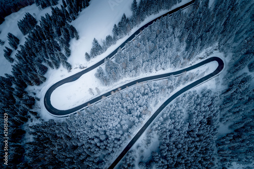 Aerial view of winding road through mountains in winter, Salzburg, Austria