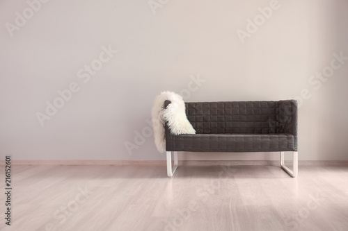 Comfortable sofa near light...