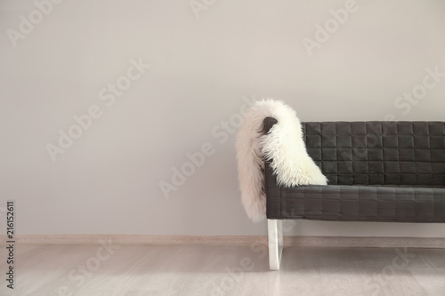 Comfortable sofa near light...