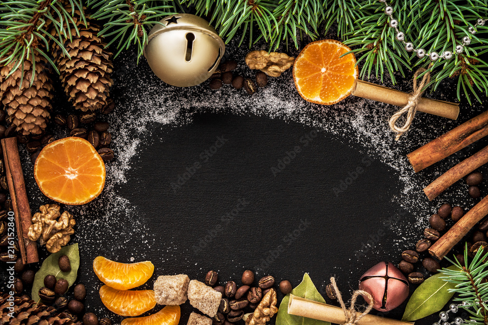 cones and spruce branches on the New Year`s black background. cones and spruce branches on the New Year`s black background.