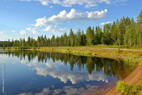 Picturesque evening on northern lake. Summer landscape. Finnish Lapland