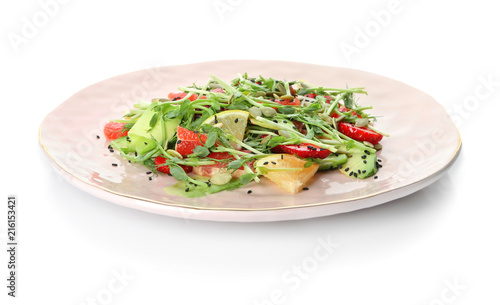 Plate with delicious fresh salad on white background