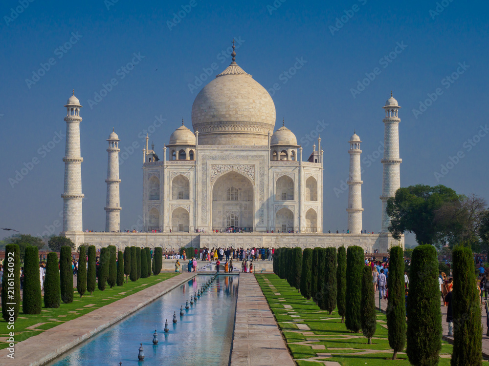 Fototapeta premium The Taj Mahal, the ivory-white marble mausoleum in the city of Agra, which was commissioned in 1632 by the Mughal emperor, Shah Jahan, to house the tomb of his queen, Mumtaz Mahal.