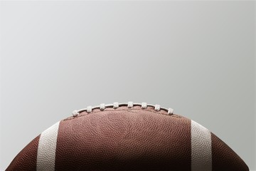 American football ball on background