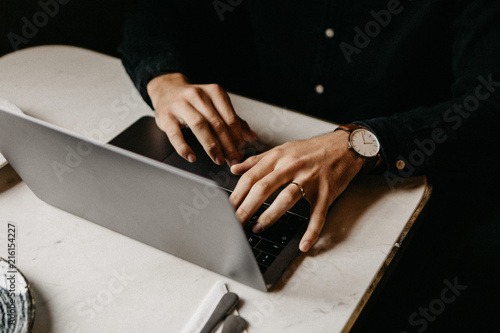 Man typing on laptop
