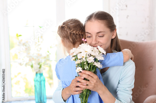 Mother receiving flowers fr...