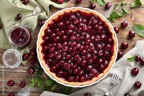 Tasty cherry pie on wooden table