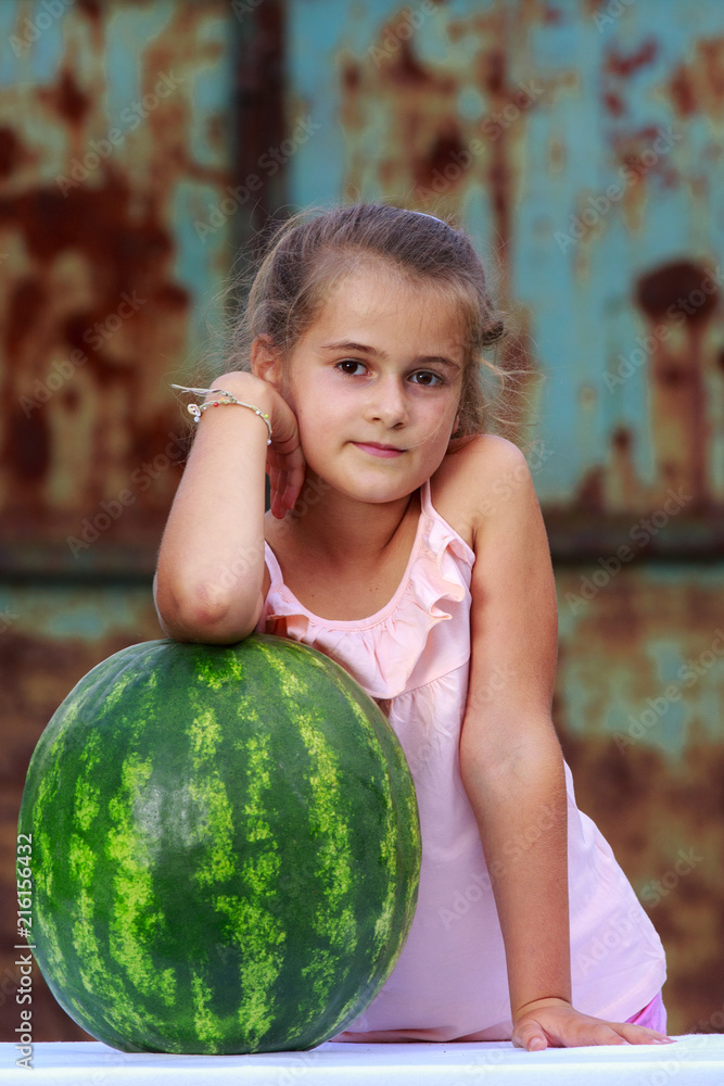 Fototapeta premium sweet little girl and watermelon