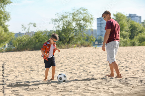 Little boy with his dad pla...