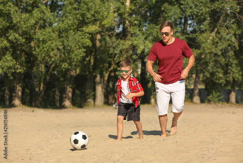 Little boy with his dad pla...