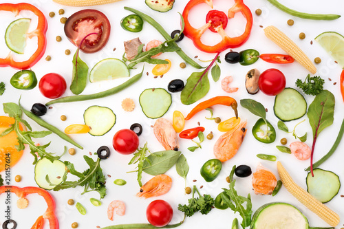 Fresh vegetables and seafood on white background