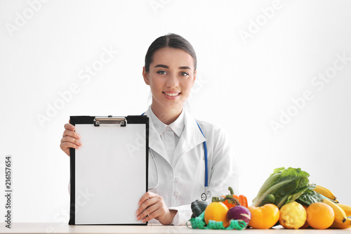 Female nutritionist sitting...