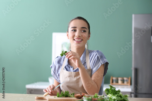 Young woman preparing tasty...
