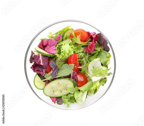 Glass bowl with fresh vegetable salad on white background