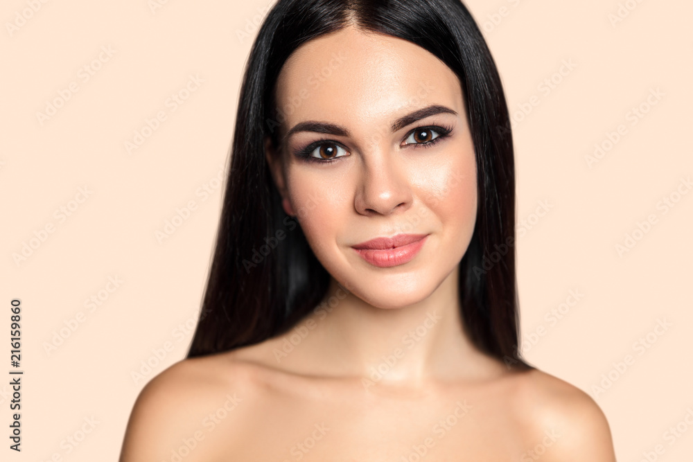 Beauty portrait of young brunette woman with perfect healthy skin and smooth hait. Attractive model with natural professional make up. Hairdress salon and cosmetics concept Beauty portrait of young brunette woman with perfect healthy skin and smooth hait. Attractive model with natural professional make up. Hairdress salon and cosmetics concept
