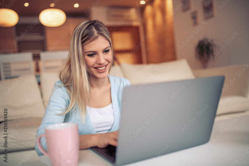 Woman using laptop at home Woman using laptop at home