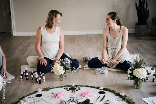 Women around circle in yoga retreat photo
