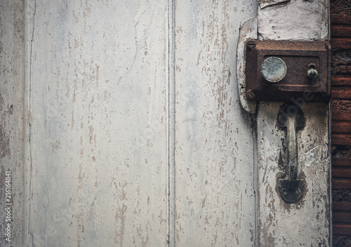Old rusty door lock on wooden antique door