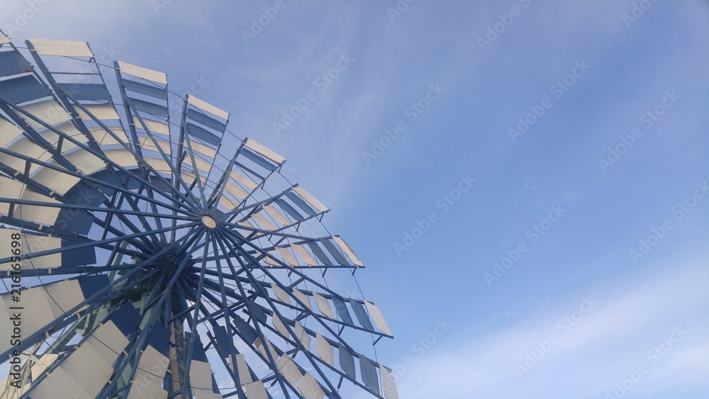Blue windmill in a blue sky