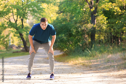 Sporty young man resting after training outdoors © Pixel-Shot