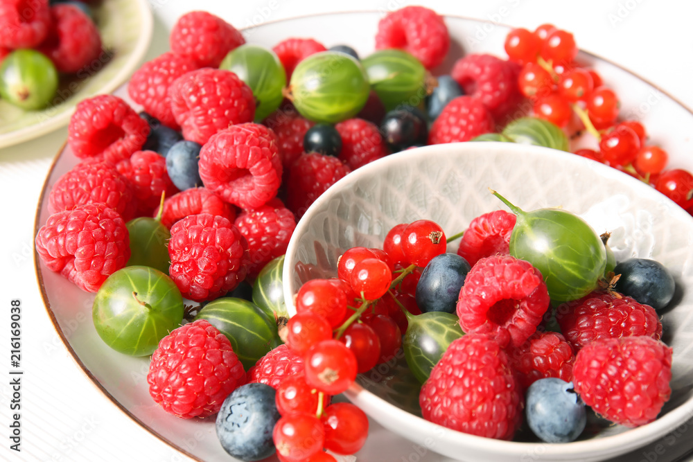 Plates with delicious ripe berries Plates with delicious ripe berries