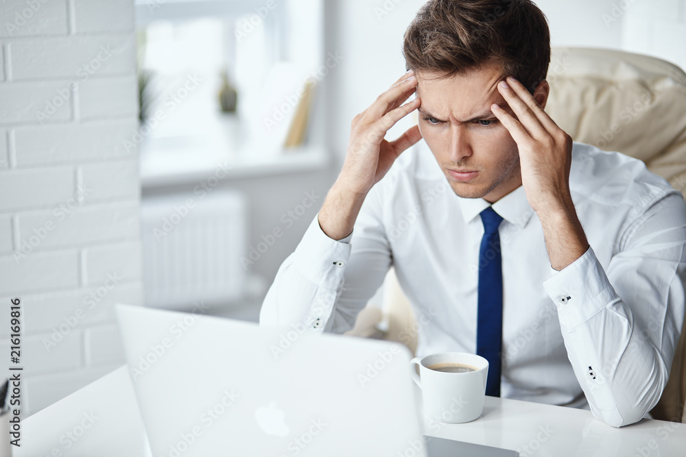 Young handsome businessman has a stressfull situation Young handsome businessman has a stressfull situation