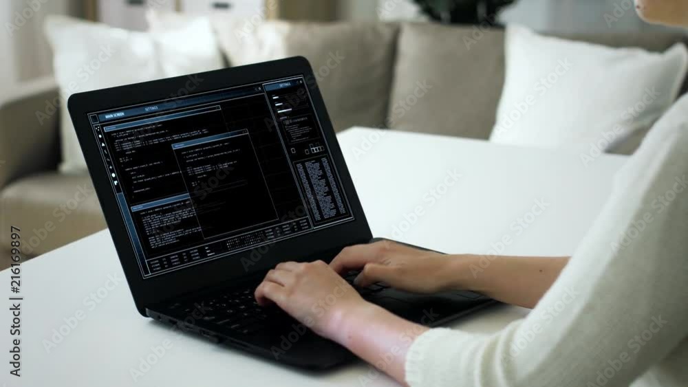 technology and programming concept - woman or programmer working on virtual data on laptop computer screen at home technology and programming concept - woman or programmer working on virtual data on laptop computer screen at home