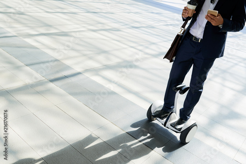 Businessman on hoverboard photo