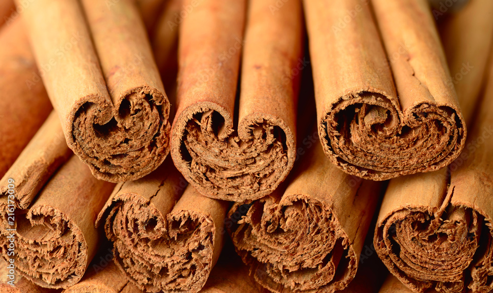 food background of ceylon cinnamon sticks - obrazy, fototapety, plakaty 