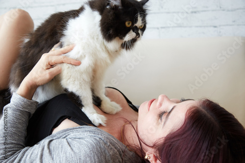 Woman resting with cat