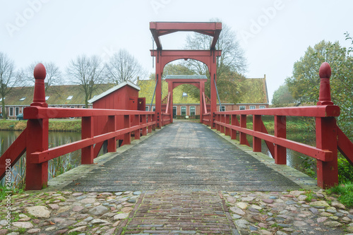 The access bridge to Bourtange with on the left the access to an old fashioned toilet above the moat, a Dutch fortified village in the province of Groningen