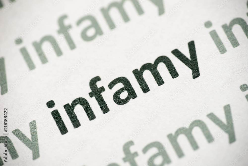 word infamy printed on paper macro