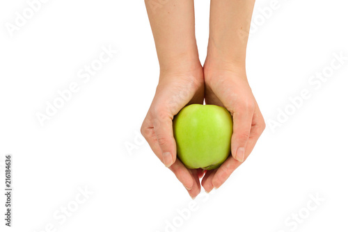 Green apple in woman hand  isolated on white background.
