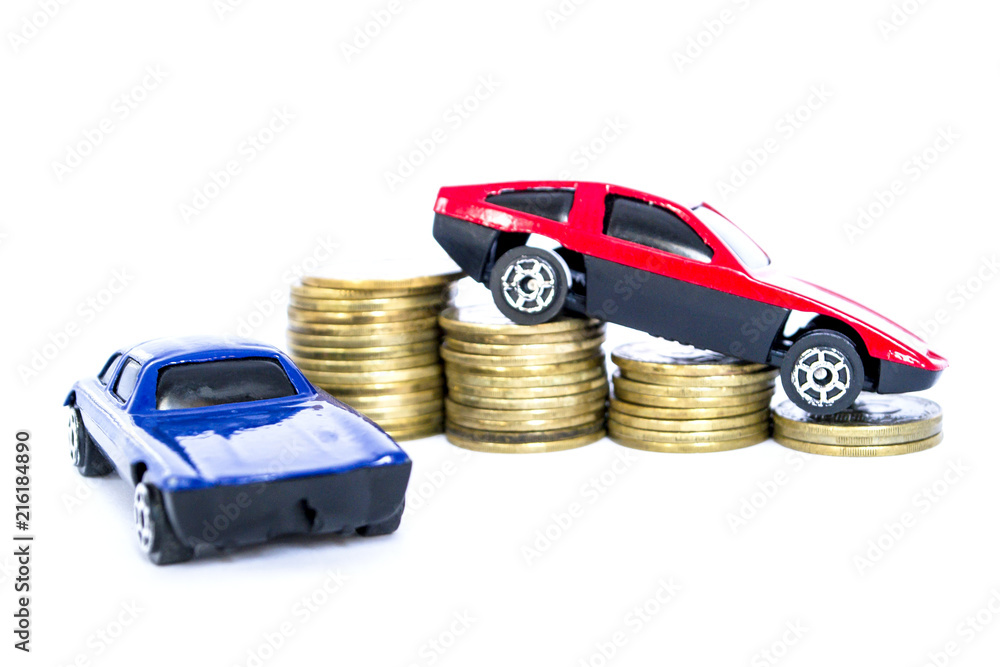 Isolated toy cars red and blue interact with gold coins. Isolated toy cars red and blue interact with gold coins.