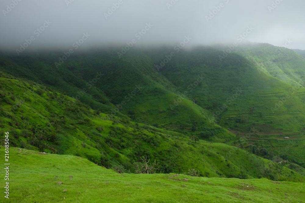 Fototapeta premium Lush green monsoon nature landscape mountains, hills, Purandar, Maharashtra, India 