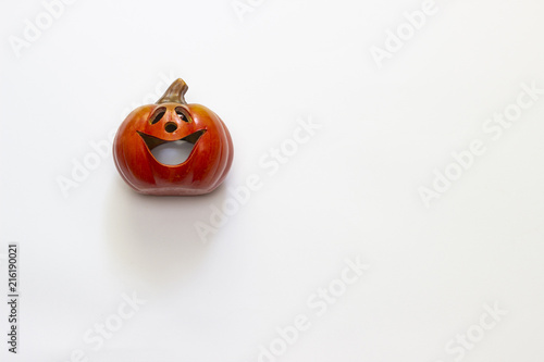 pumpkin on white background, workout for Halloween postcards. Halloween Pumpkin Candle.
