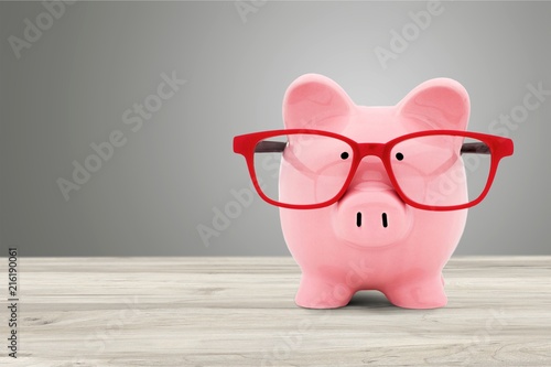 Pink ceramic piggy bank with copy space