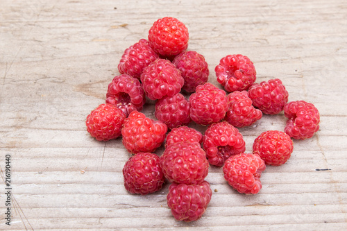 Raspberries on a wooden background. Selective focus.