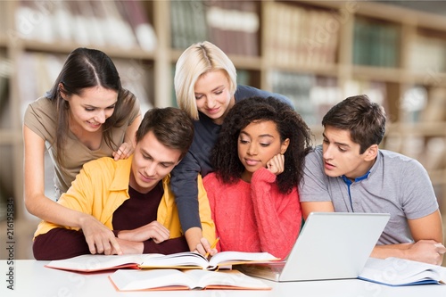 Four Young students studying subject on background © BillionPhotos.com