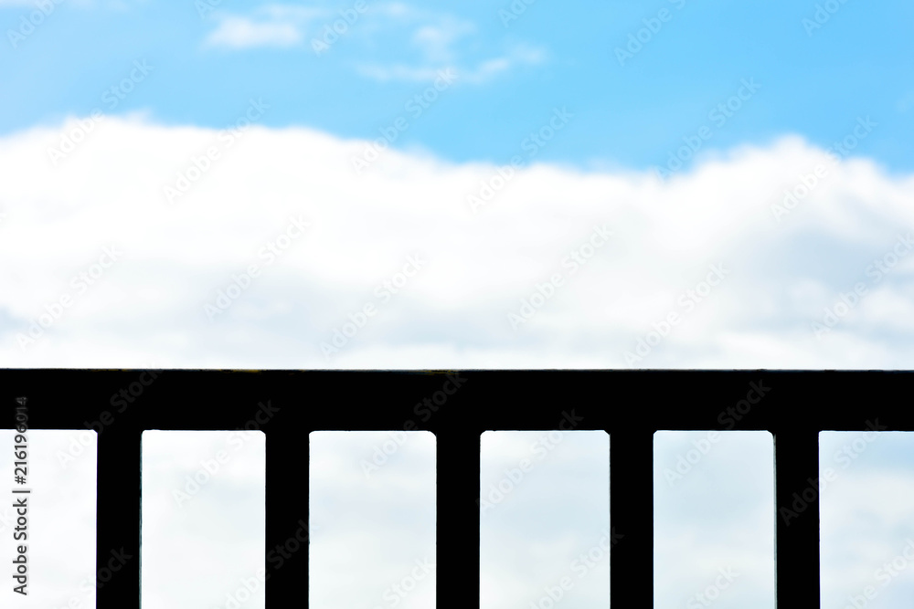 Fototapeta premium silhouette of metal fence with sky