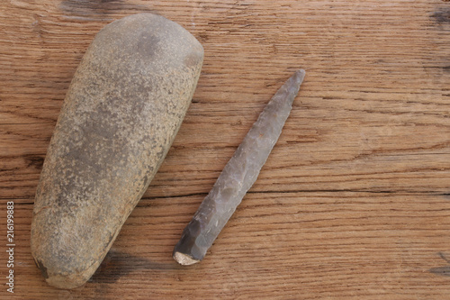 stone age tool, ax head and arrowhead photo
