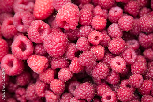 Fresh raspberries background closeup photo 