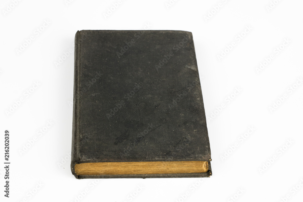 Old destroyed book on a white table. Old-style cover. Old destroyed book on a white table. Old-style cover.