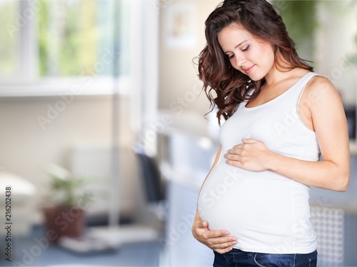 Pregnant young woman in white t shirt Free Download Pregnant young woman in white t shirt - GFXLoad