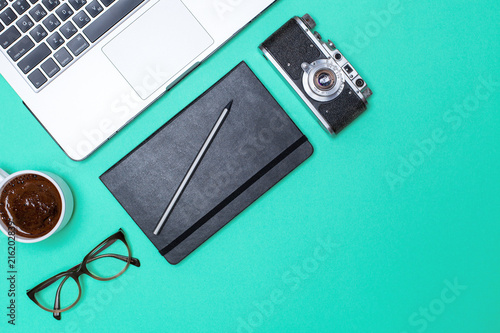 Wallpaper Mural office desk with a laptop, a smartphone, a cup of coffee, glasses, a notebook and accessories on a bright background with space for text. Top view with copy space, flat lay Torontodigital.ca