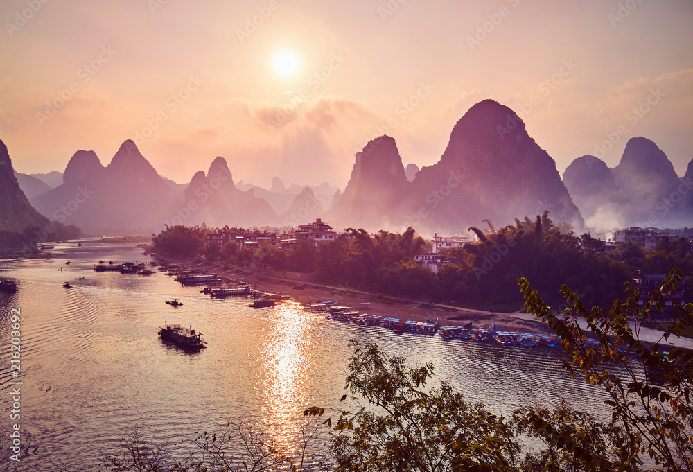 Scenic sunset over Li River in Xingping, color toning applied, China. 
