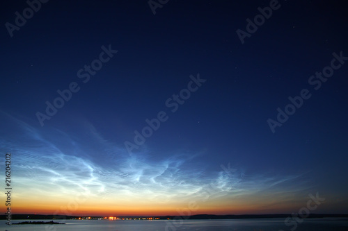 Star sky with noctilucent clouds © mikhailg