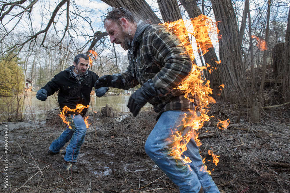 Stunt Men light themselves on fire and fight in their backyard