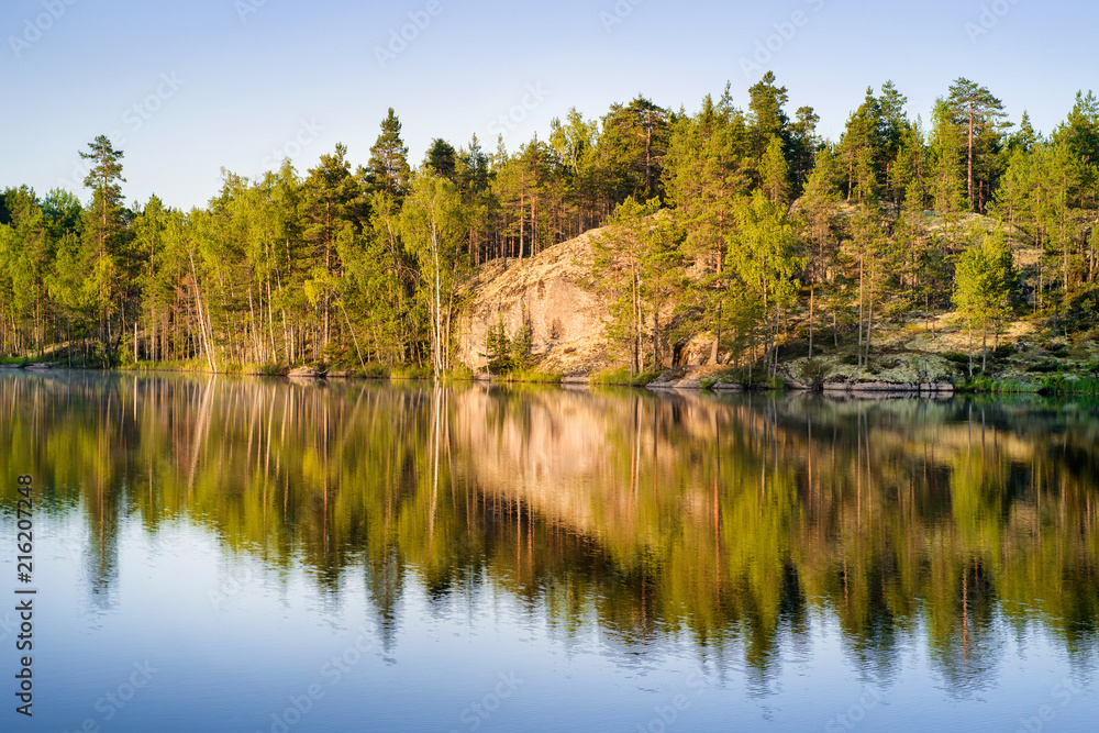 Forest lake at sunrise in Karelia Forest lake at sunrise in Karelia