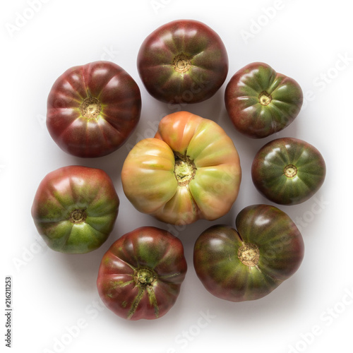 Konstfotografi Organic heirloom Brandywine tomatoes in a circle, isolated on white, top view
